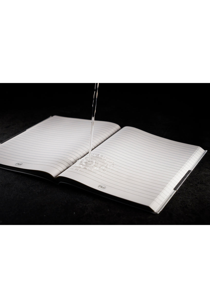 Stone paper Journal notebook with water being pour on